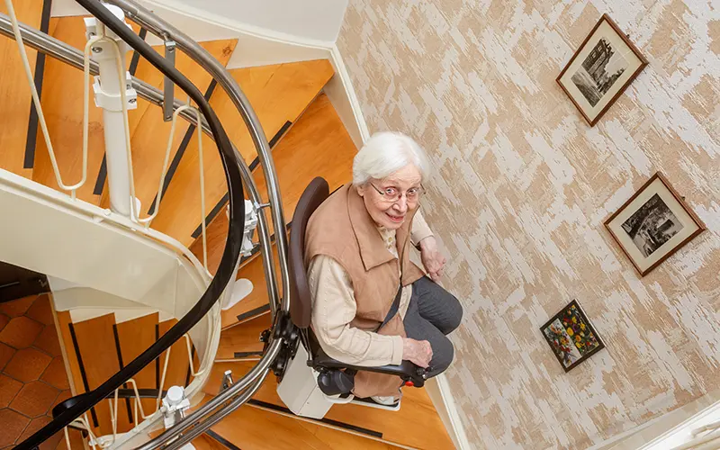 woman on a stair lift